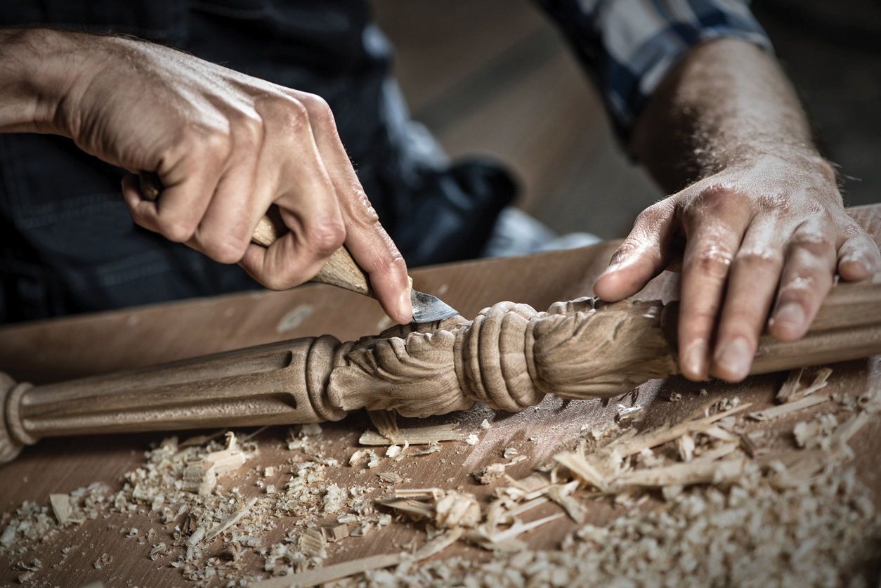 34111879 - close up carpenter's hands that work with cutter