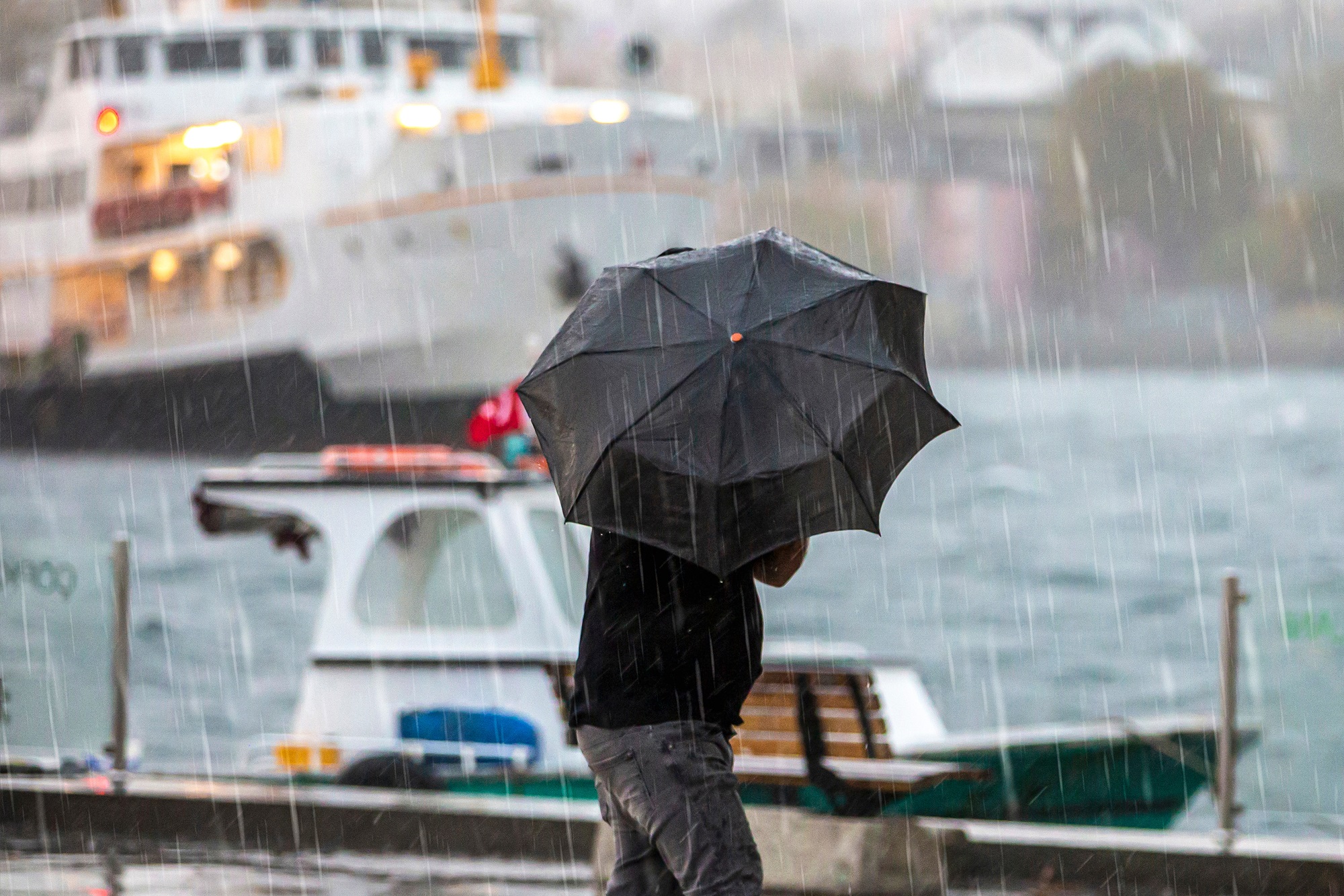 Man,Walking,In,Rainy,Weather