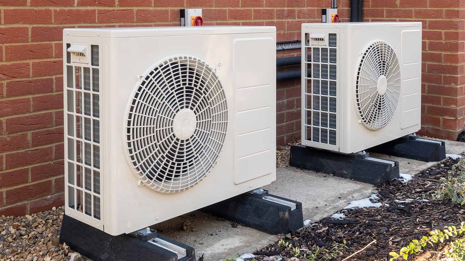 Two,Air,Source,Heat,Pumps,Installed,On,The,Exterior,Of